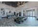 Open-concept clubhouse interior with modern kitchen, stylish seating, and ample space for socializing and events at 37185 N Falabella Dr, San Tan Valley, AZ 85140
