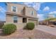 Inviting two-story home with desert landscaping, charming exterior, and brick-paved driveway at 37185 N Falabella Dr, San Tan Valley, AZ 85140