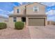 Charming two-story home featuring a two-car garage, desert landscaping, and a welcoming entrance at 37185 N Falabella Dr, San Tan Valley, AZ 85140