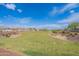 Expansive community greenspace offers a serene environment with walking paths and native landscaping at 37185 N Falabella Dr, San Tan Valley, AZ 85140