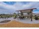 Community picnic area featuring shaded seating, tables, and landscaped surroundings for relaxation at 37185 N Falabella Dr, San Tan Valley, AZ 85140