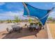 Shaded picnic area with tables and seating provides a comfortable space for outdoor gatherings at 37185 N Falabella Dr, San Tan Valley, AZ 85140