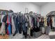 Walk-in closet with ample hanging space, shelving, and storage solutions for organized clothing at 37185 N Falabella Dr, San Tan Valley, AZ 85140