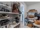 Walk-in closet with ample shelving, tiered storage, and room to access all of your accessories at 37185 N Falabella Dr, San Tan Valley, AZ 85140