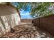 Fenced backyard with mature trees and desert landscaping at 3941 W Desert Hills Dr, Phoenix, AZ 85029