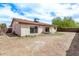 The backyard offers privacy with desert landscaping and mature trees at 3941 W Desert Hills Dr, Phoenix, AZ 85029