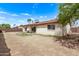 The backyard offers privacy with a block fence, desert landscaping and an extended patio at 3941 W Desert Hills Dr, Phoenix, AZ 85029