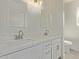 Modern bathroom featuring dual sinks, white cabinets, and quartz countertops at 3941 W Desert Hills Dr, Phoenix, AZ 85029