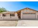 Inviting single-story home with a neutral color palette, a two car garage, and a well kept walkway at 3941 W Desert Hills Dr, Phoenix, AZ 85029