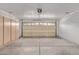 Spacious garage features built-in storage cabinets and an automatic door opener at 3941 W Desert Hills Dr, Phoenix, AZ 85029