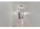 Hallway leading to the garage or back door features tile flooring and a water heater at 3941 W Desert Hills Dr, Phoenix, AZ 85029