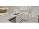 Modern kitchen with quartz counters, stainless steel appliances, and ample cabinet space at 3941 W Desert Hills Dr, Phoenix, AZ 85029