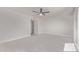 Bright living room features a modern ceiling fan and neutral flooring at 3941 W Desert Hills Dr, Phoenix, AZ 85029