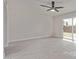 Bright living room features a modern ceiling fan and sliding glass door to the backyard at 3941 W Desert Hills Dr, Phoenix, AZ 85029