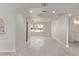 Spacious open-concept living area with wood-look floors and abundant natural light at 3941 W Desert Hills Dr, Phoenix, AZ 85029