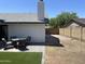 The backyard features a new outdoor dining set and new patio at 4038 W Windrose Dr, Phoenix, AZ 85029