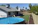 An above-ground pool and lush lawn make this backyard an oasis at 4038 W Windrose Dr, Phoenix, AZ 85029