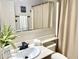 Well-lit bathroom featuring a clean sink area and neutral-colored fixtures at 4038 W Windrose Dr, Phoenix, AZ 85029