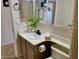 Bright bathroom featuring a neutral color scheme, single vanity, and decorative accents at 4038 W Windrose Dr, Phoenix, AZ 85029