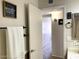 Bathroom entryway with neutral colors, decorative towel rack, and view into a clean, well-lit space at 4038 W Windrose Dr, Phoenix, AZ 85029