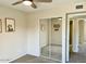 Bright bedroom featuring neutral decor, carpeted floors, closet with sliding mirrored doors, and interior access at 4038 W Windrose Dr, Phoenix, AZ 85029