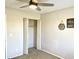 Cozy bedroom showcasing a closet with folding doors and wall accents at 4038 W Windrose Dr, Phoenix, AZ 85029
