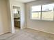 Neutral bedroom featuring carpet floors and ensuite bathroom at 4038 W Windrose Dr, Phoenix, AZ 85029