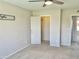 Neutral bedroom featuring ceiling fan, carpet floors, and closet at 4038 W Windrose Dr, Phoenix, AZ 85029