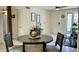 Dining area with modern decor, neutral color palette, and natural light, adjacent to living area at 4038 W Windrose Dr, Phoenix, AZ 85029