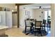 Cozy dining area featuring a modern light fixture and neutral tones, adjacent to the kitchen at 4038 W Windrose Dr, Phoenix, AZ 85029