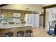 Modern kitchen featuring granite countertops, stainless steel appliances, and breakfast bar at 4038 W Windrose Dr, Phoenix, AZ 85029