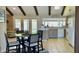 Open kitchen with French doors, dining area, and modern appliances offering a perfect layout at 4038 W Windrose Dr, Phoenix, AZ 85029