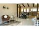 Inviting living room with tile flooring, a dining area, and bright natural light at 4038 W Windrose Dr, Phoenix, AZ 85029