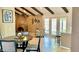 Inviting living room showcasing a brick fireplace, French doors, and bright natural light at 4038 W Windrose Dr, Phoenix, AZ 85029