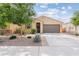 Charming single-story home with desert landscaping, neutral colors, and a welcoming entrance at 4087 W Coneflower Ln, San Tan Valley, AZ 85144