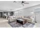 Spacious living room showcasing an open floor plan with modern furnishings and lots of natural light at 4087 W Coneflower Ln, San Tan Valley, AZ 85144