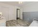 Cozy bedroom featuring gray wood floors, a closet, neutral paint colors, and tasteful accents at 4215 S Marisol Ln, Gilbert, AZ 85297