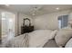 An elegant bedroom with wood floors and an ensuite bathroom at 4215 S Marisol Ln, Gilbert, AZ 85297