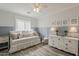 This charming bedroom has a daybed, soft wallpaper, and stylish decor at 4215 S Marisol Ln, Gilbert, AZ 85297