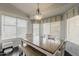 Bright dining area with a large table, bench seating, and plenty of natural light at 4215 S Marisol Ln, Gilbert, AZ 85297