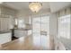 Well-lit kitchen with white cabinets, stainless steel appliances, and open access to the dining area at 4215 S Marisol Ln, Gilbert, AZ 85297