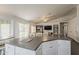 Kitchen island with white cabinets and a sliding door to the backyard at 4215 S Marisol Ln, Gilbert, AZ 85297