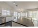 Open kitchen with island, stainless steel appliances, and a view of the backyard through large windows at 4215 S Marisol Ln, Gilbert, AZ 85297