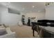 Open-concept living area with stylish decor, neutral tones, and carpet, blending with hardwood flooring at 4215 S Marisol Ln, Gilbert, AZ 85297