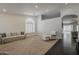 Bright living room with carpet flooring, white walls, and a large arched window with shutters at 4215 S Marisol Ln, Gilbert, AZ 85297