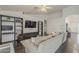Well-appointed living room with hardwood floors, a media center, and an open entryway at 4215 S Marisol Ln, Gilbert, AZ 85297