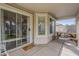 Covered patio featuring tiled flooring, ample seating with a picnic table, and seamless indoor-outdoor flow at 4215 S Marisol Ln, Gilbert, AZ 85297