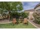 Inviting backyard seating area with lush landscaping, providing a tranquil outdoor retreat at 4497 E Ficus Way, Gilbert, AZ 85298