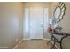 Inviting front entry with decorative mirror, console table, and stylish tile flooring at 4497 E Ficus Way, Gilbert, AZ 85298
