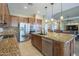 Bright kitchen showcasing granite counters, stainless steel appliances, and a double sink island at 4497 E Ficus Way, Gilbert, AZ 85298